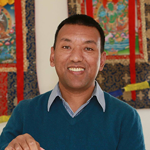 A portrait of Karma Sherpa, the CEO and Trek Leader of Sherpa Mountain Adventures