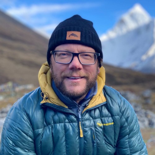 A portrait of guide Michael Leaves in the mountains
